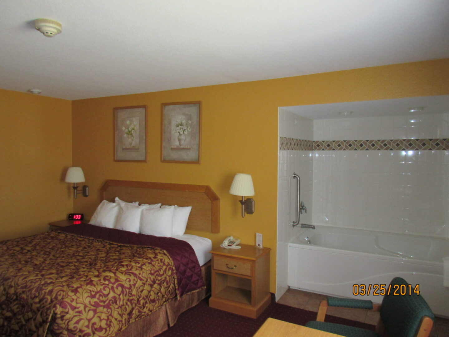 Luxury hotel bedroom with attached bathroom and white bed