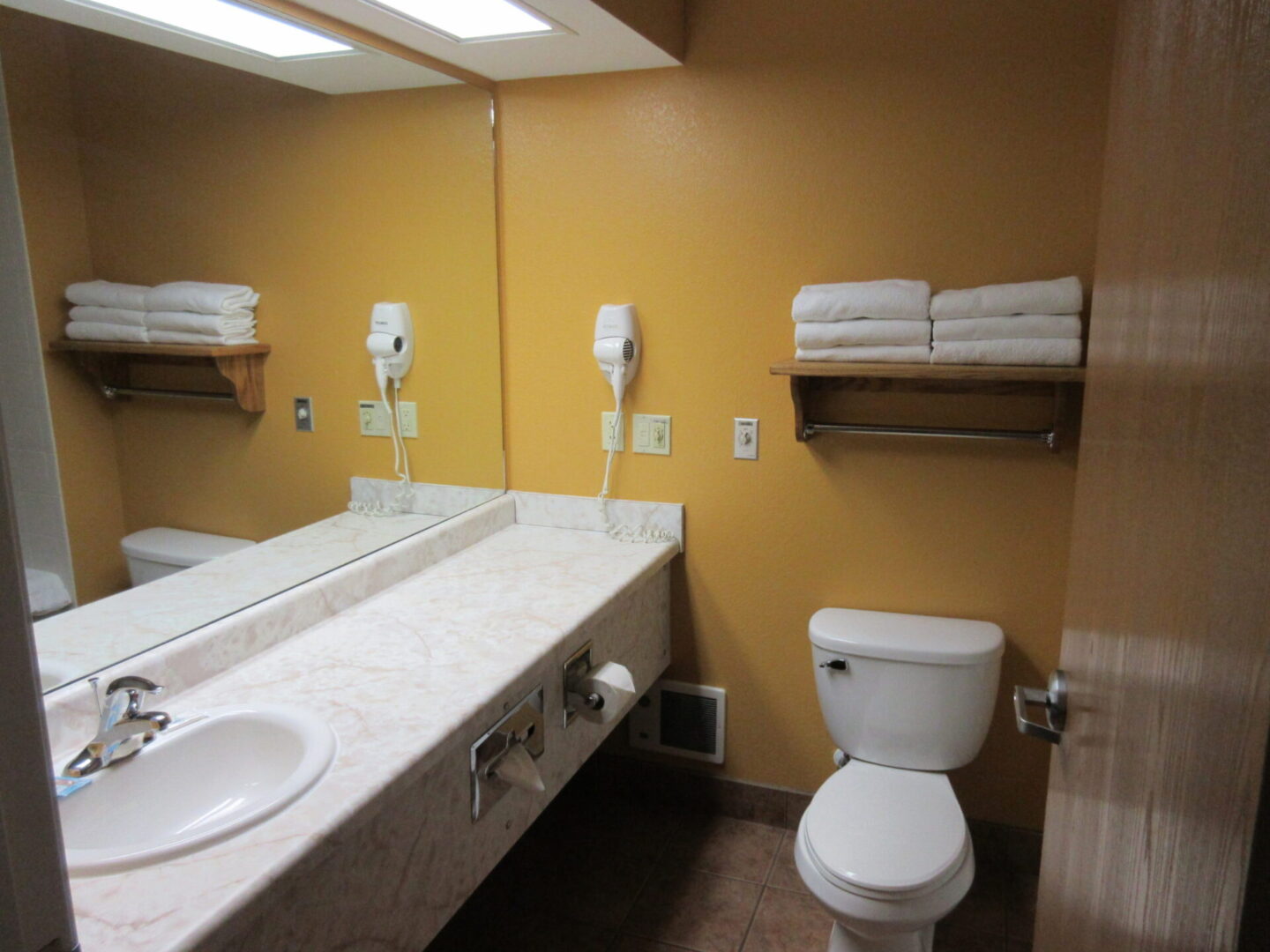 Luxury hotel washroom with water closet and wash basin