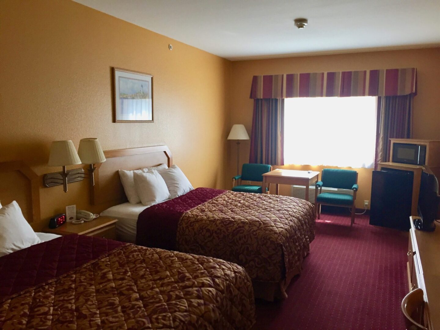 Hotel room with settee refrigerator, microwave, and more