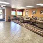 The lobby of the Parkfield Hotel with couches and chairs.