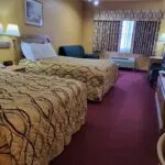 A Parkfield hotel room with two beds and a television.